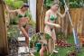 Genie Bouchard turns heads in a green bikini while doing 'yard work'